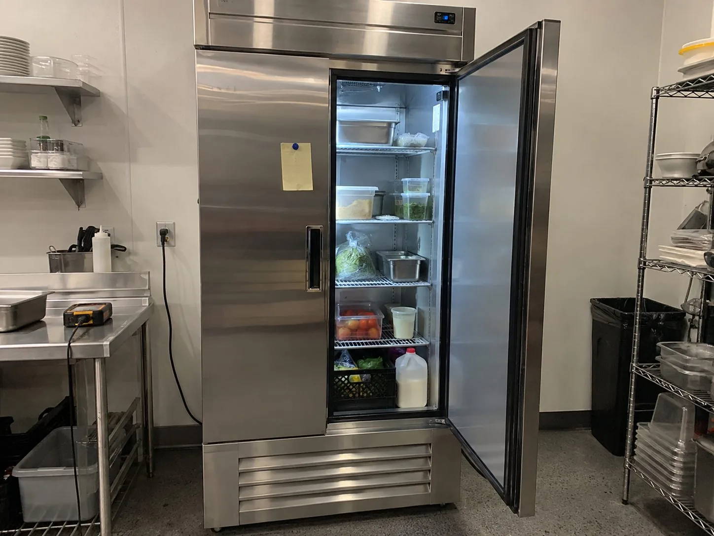 Commercial reach-in refrigerator after service in an Atlanta prep kitchen