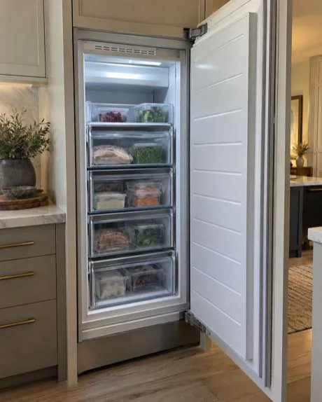 Built-in freezer column photographed after service in a customer kitchen