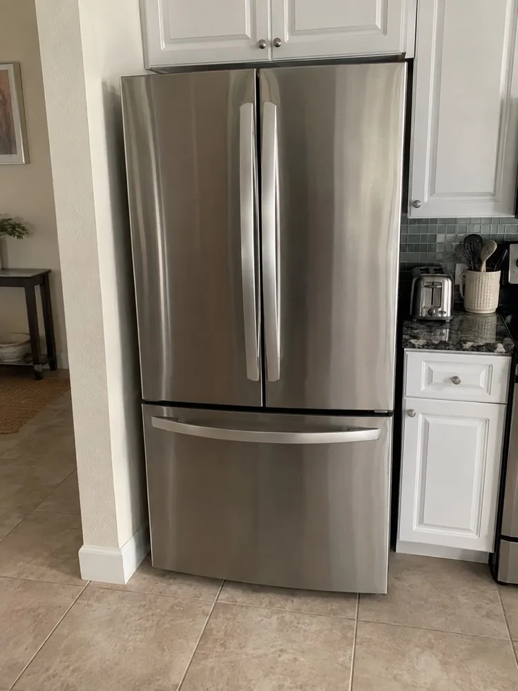 Regular residential French-door refrigerator photographed after repair in a Miami home