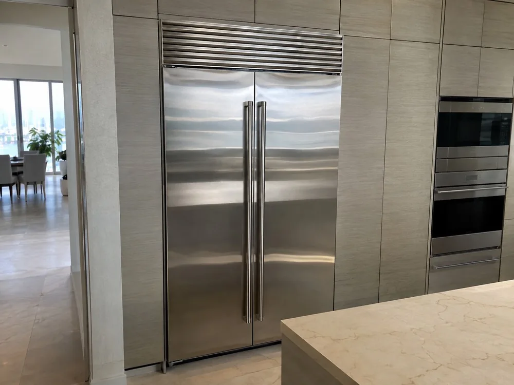 High-end built-in refrigerator photographed after repair in a Miami kitchen