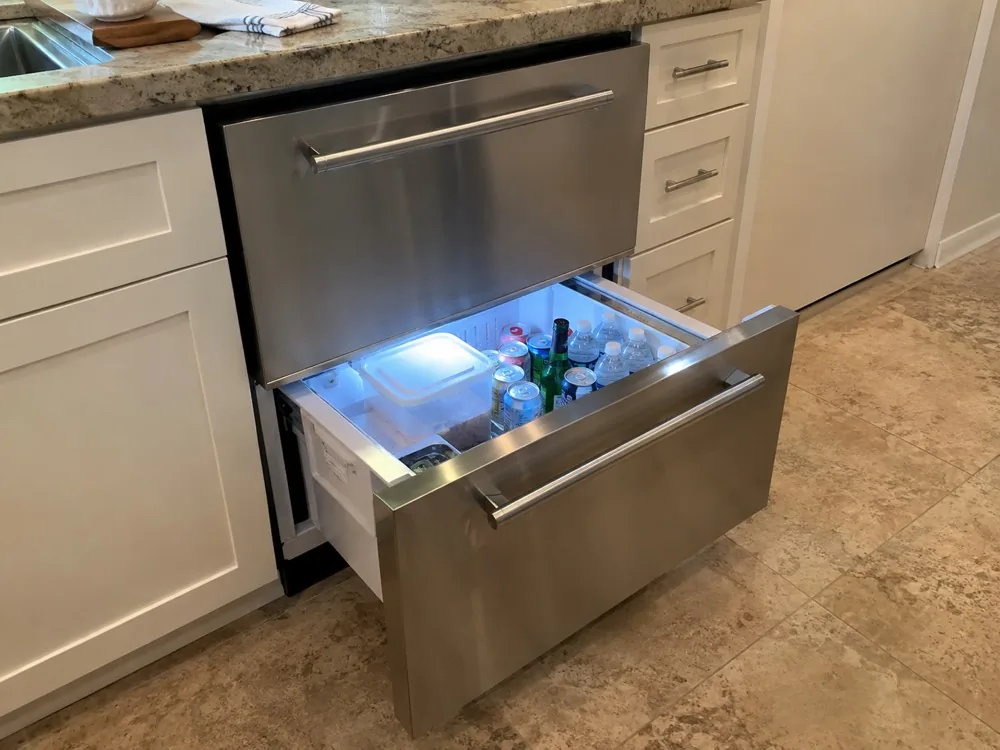 Undercounter refrigerator drawer photographed after service in a Miami kitchen