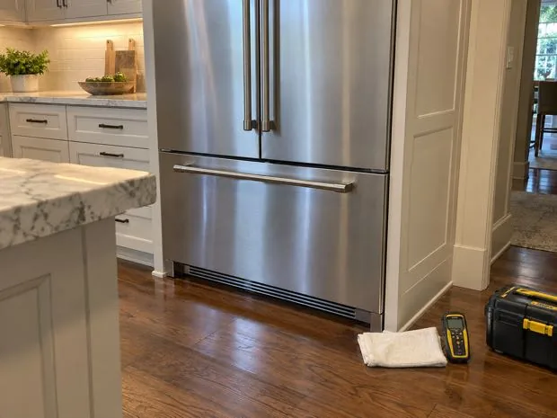 Premium French door refrigerator photographed after water system repair