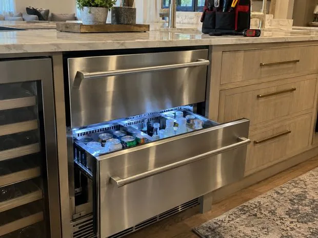 Undercounter refrigerator drawers photographed after service in a customer kitchen