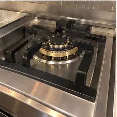 Professional rangetop burner photographed after service in a customer kitchen