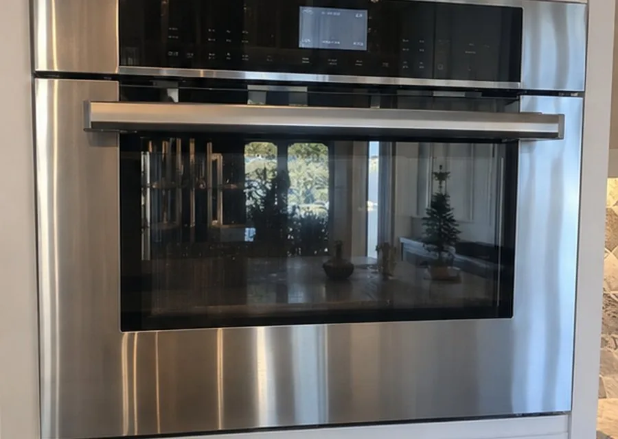 Microwave Oven with Trim Kit photographed after high-end microwave repair in a customer's home