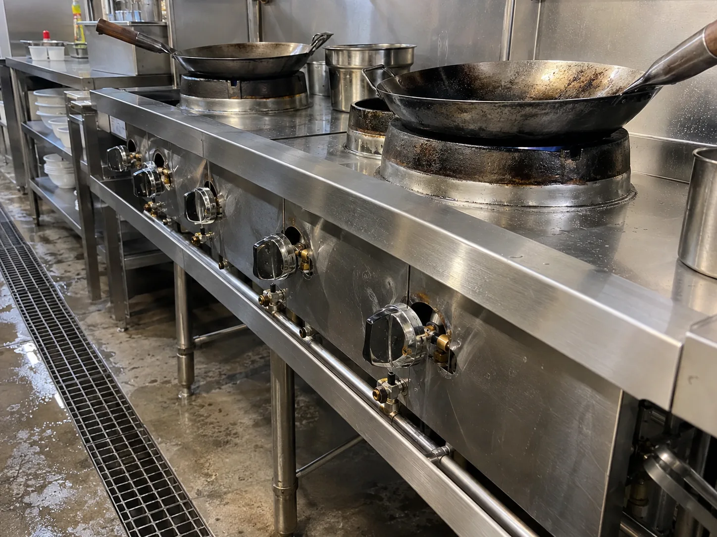 Commercial wok range control and gas valve area after repair in Atlanta