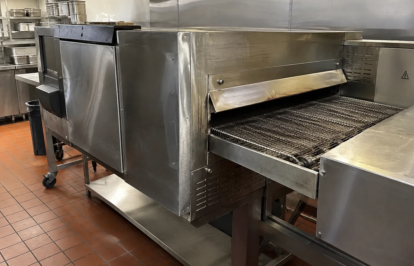 Long-belt conveyor oven after airflow and heat service in Brandon