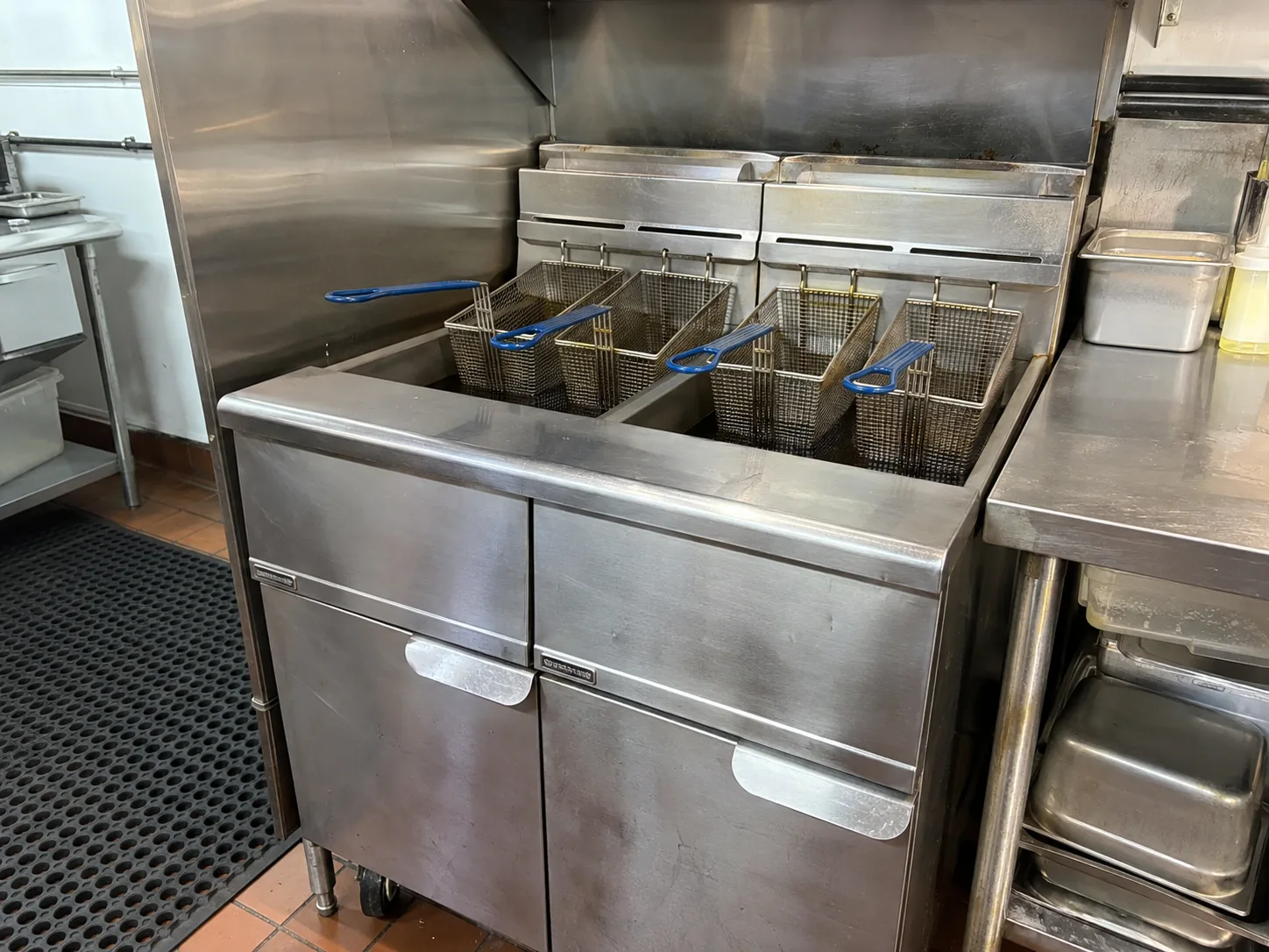 Commercial gas floor fryer ready after ignition service in Ybor City