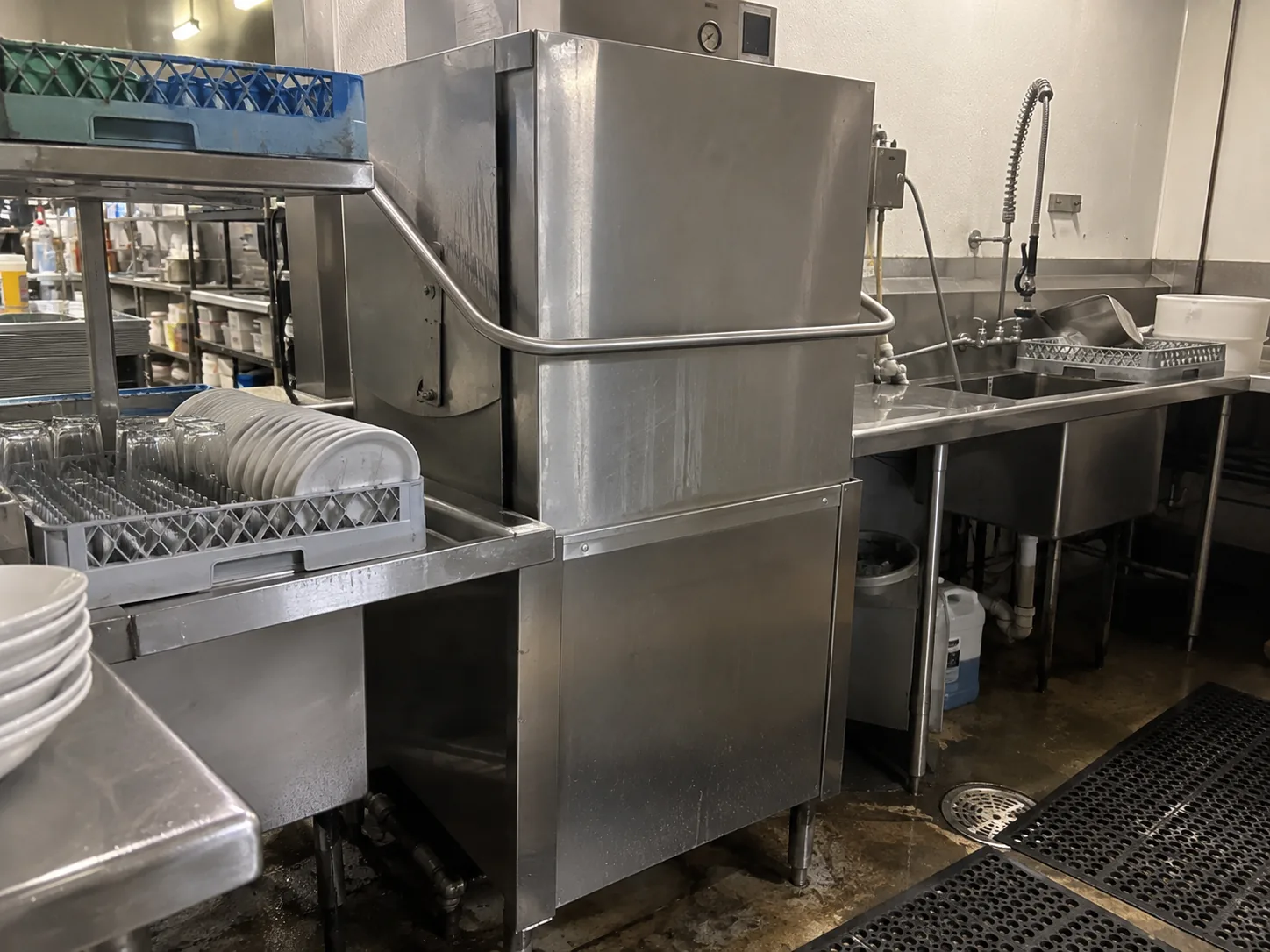Door-type commercial dishwasher ready after drain repair in Ybor City