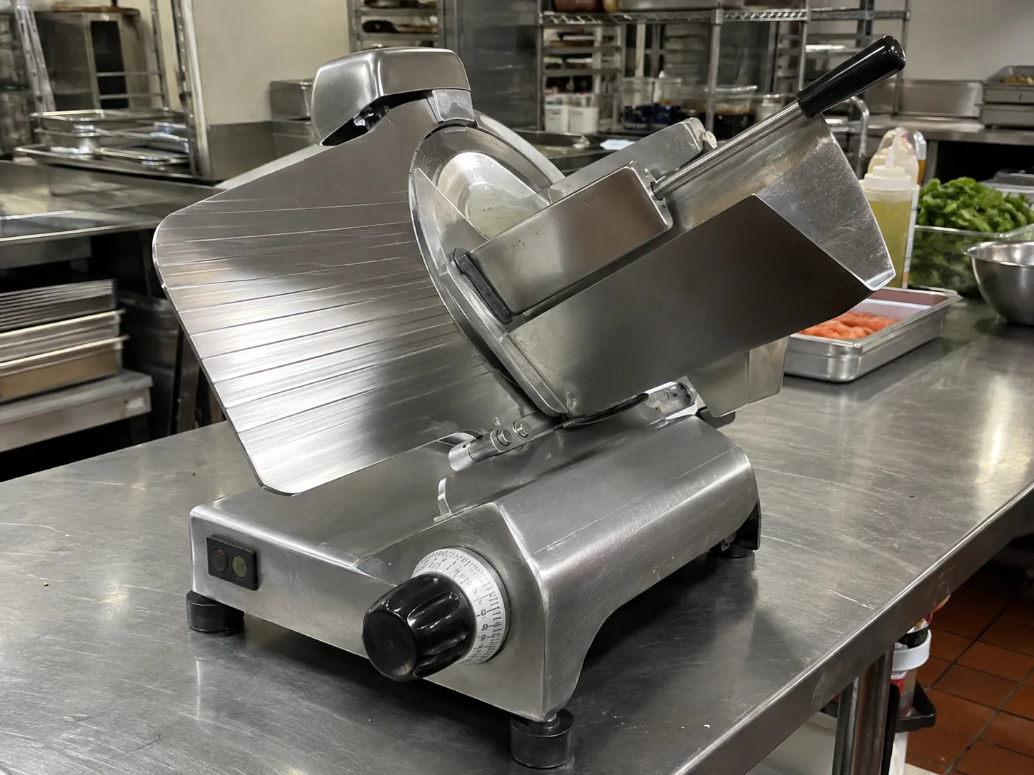 Commercial deli slicer ready after blade-drive service