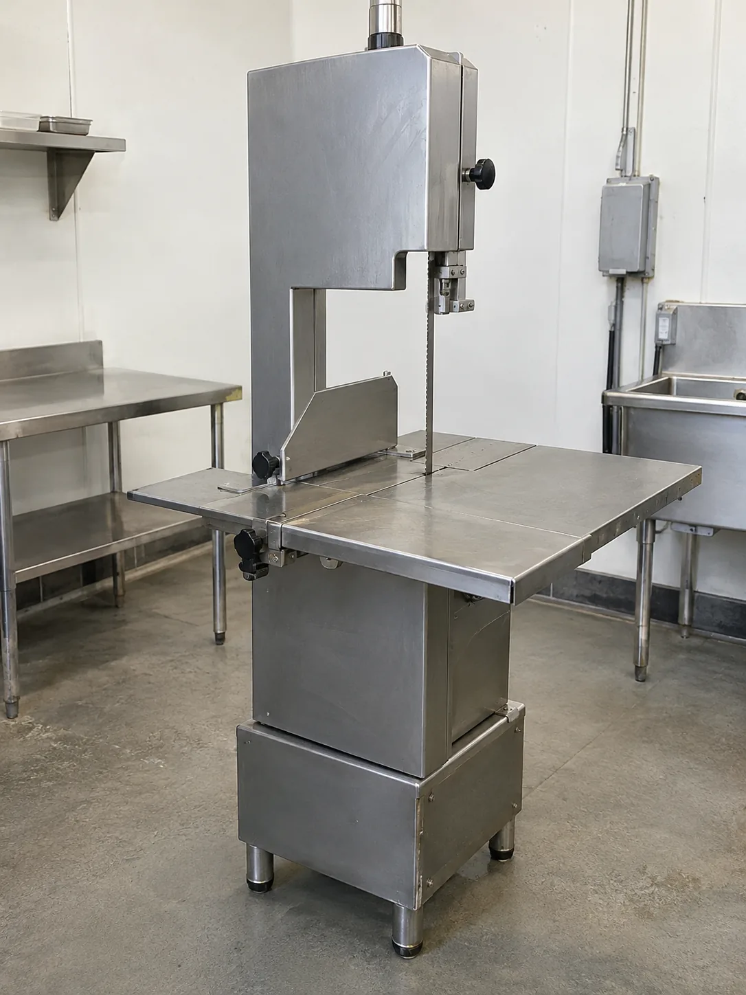 Commercial meat saw ready after blade-tracking service