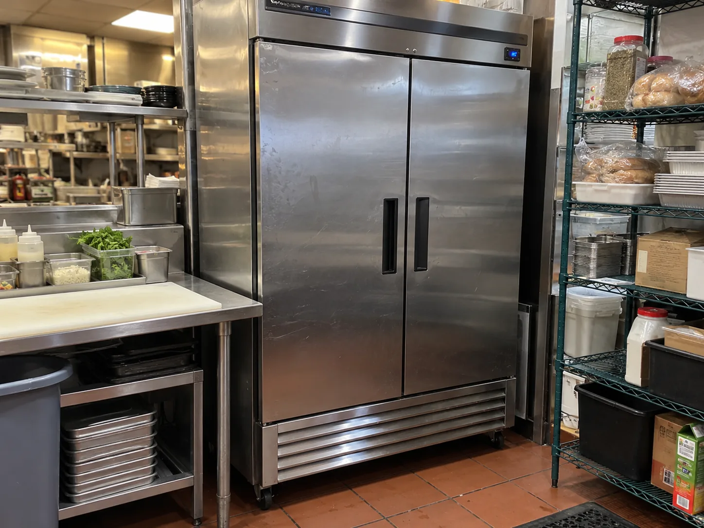 Two-door commercial reach-in refrigerator in a working Tampa restaurant after condenser airflow service