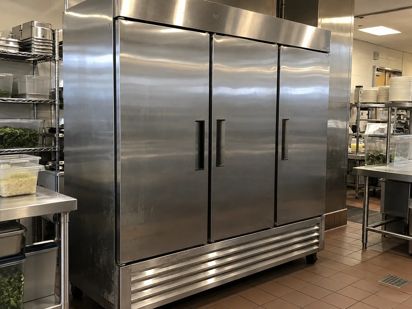 Three-door commercial reach-in refrigerator in a Riverview banquet kitchen after refrigerant-system service
