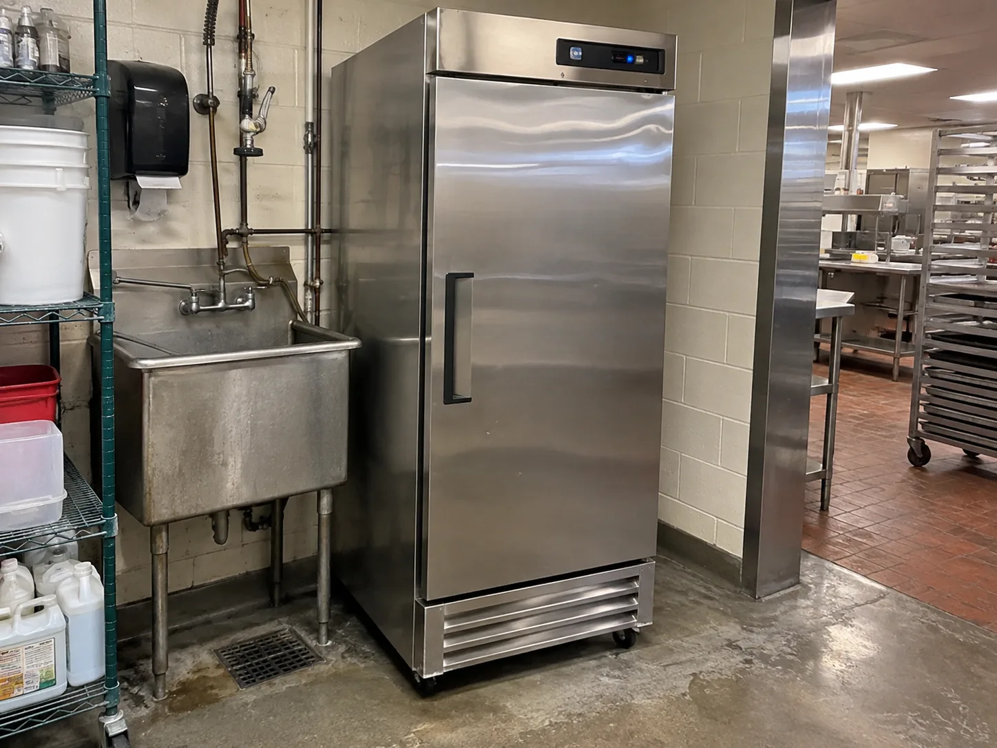 Compact one-door commercial reach-in refrigerator in a Temple Terrace cafeteria after control-relay service
