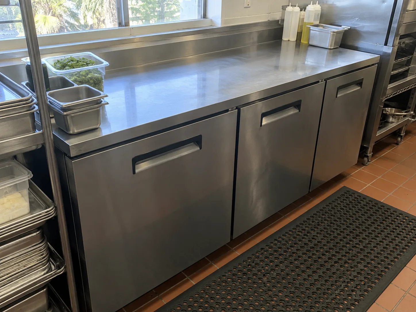 Three-door worktop refrigerator after compressor startup service in Clearwater