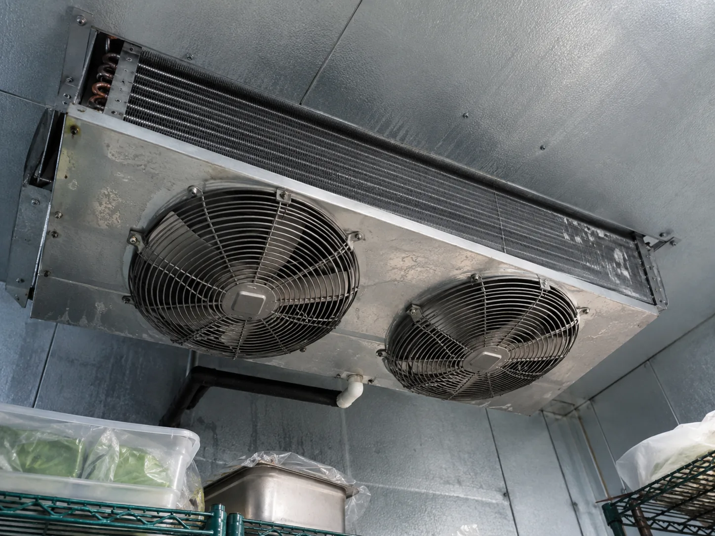 Walk-in freezer evaporator after defrost drain service