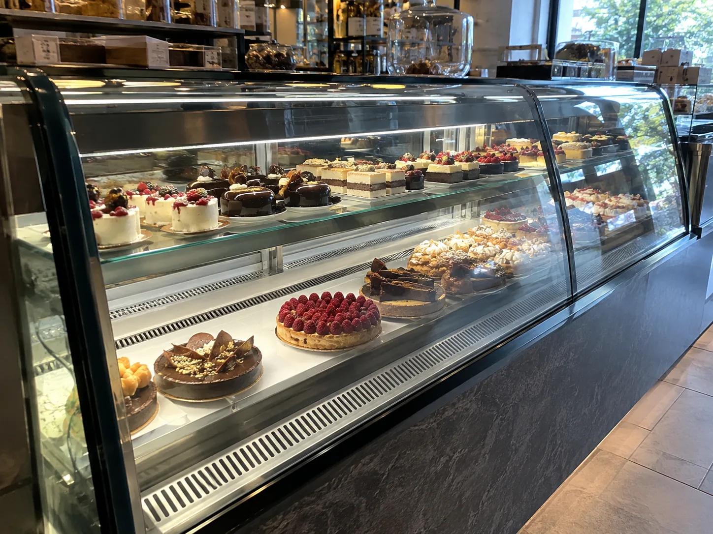 Curved-glass pastry case after condensation service