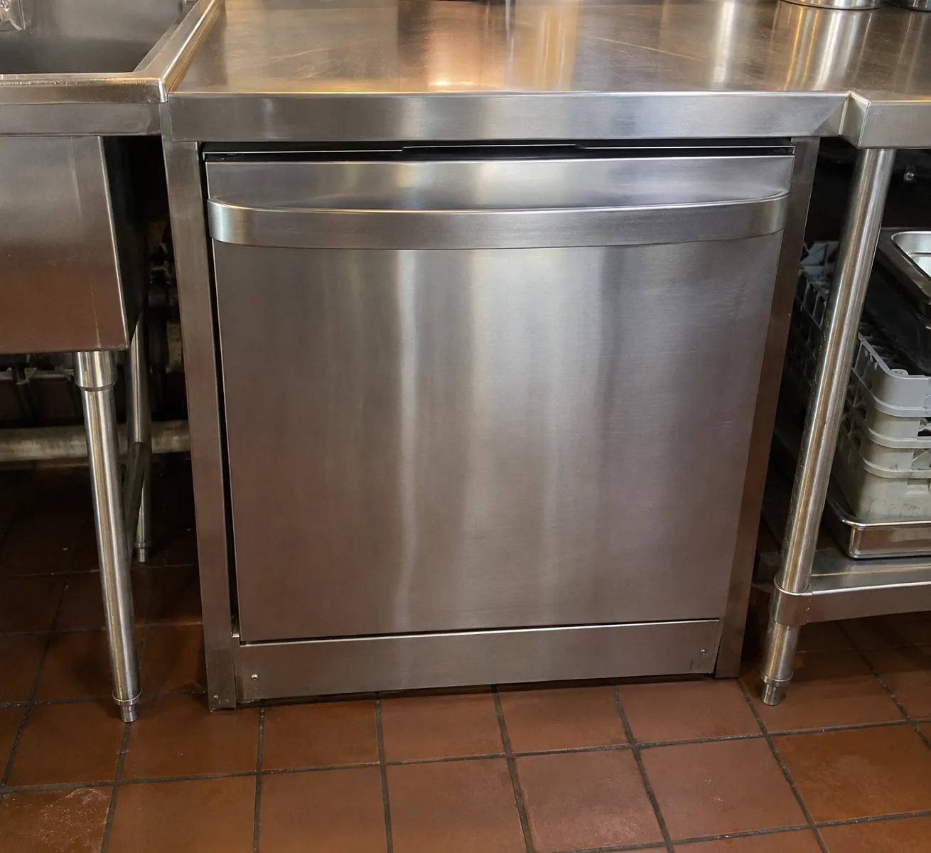 Undercounter commercial dishwasher after drainage service