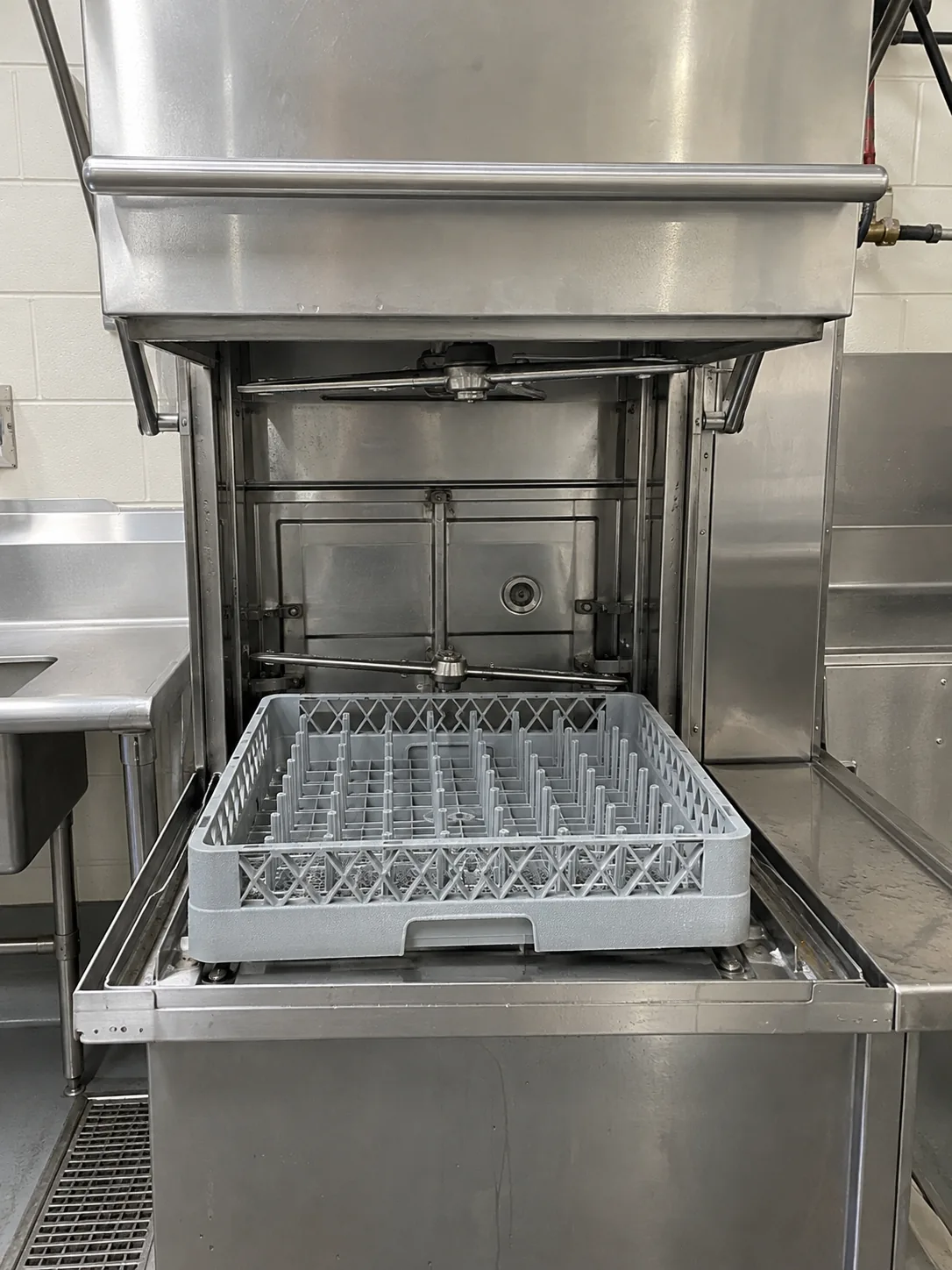 Commercial rack dishwasher after wash pump service