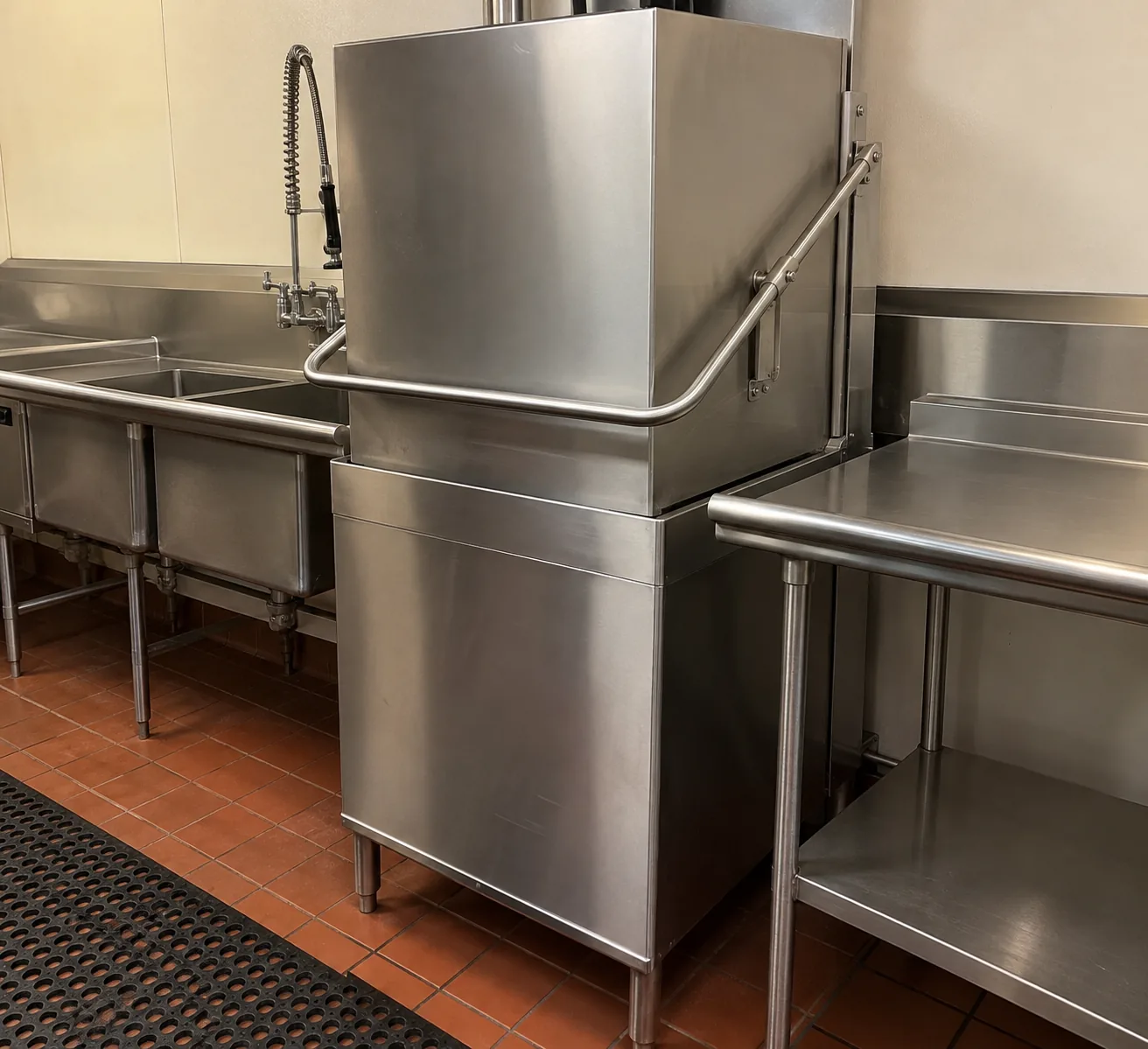 Commercial door-type dishwasher after leak service