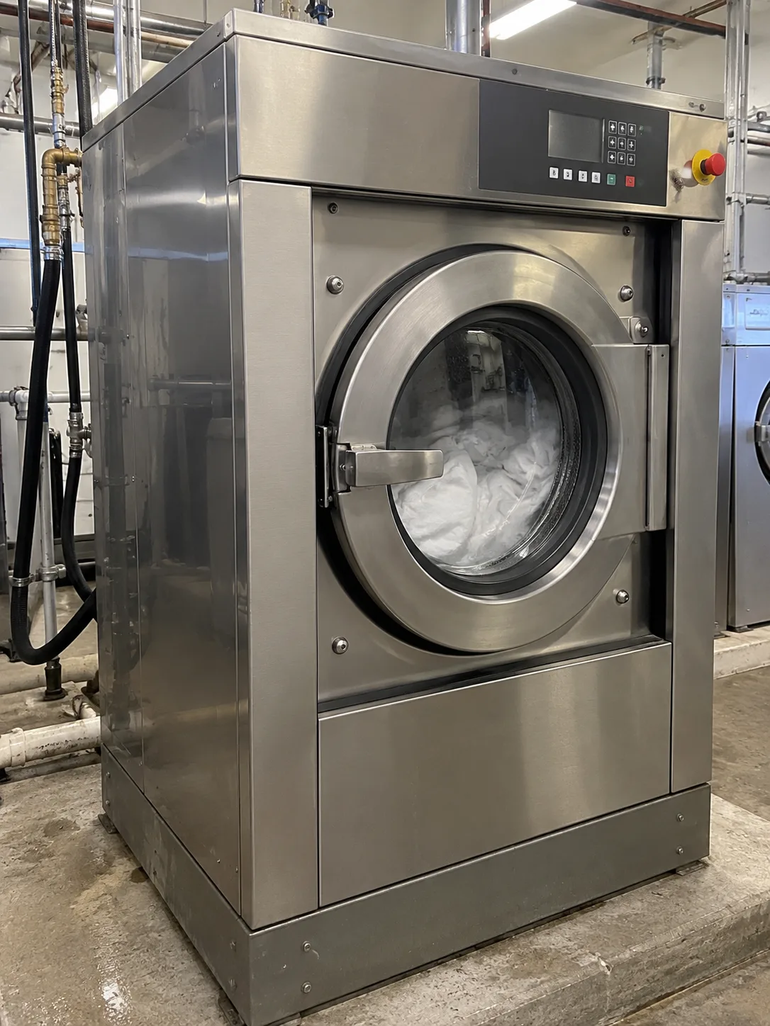 Professional industrial laundry machine after service