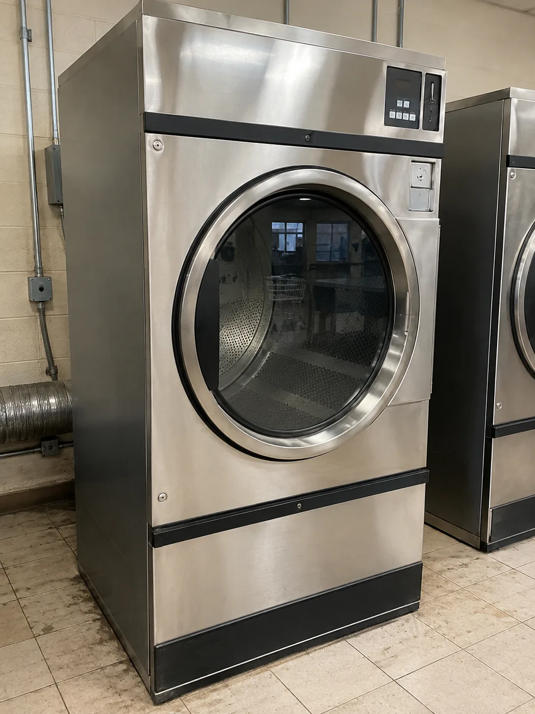 Commercial Dryer Heating Restored commercial dryer in a Tampa Bay laundry facility