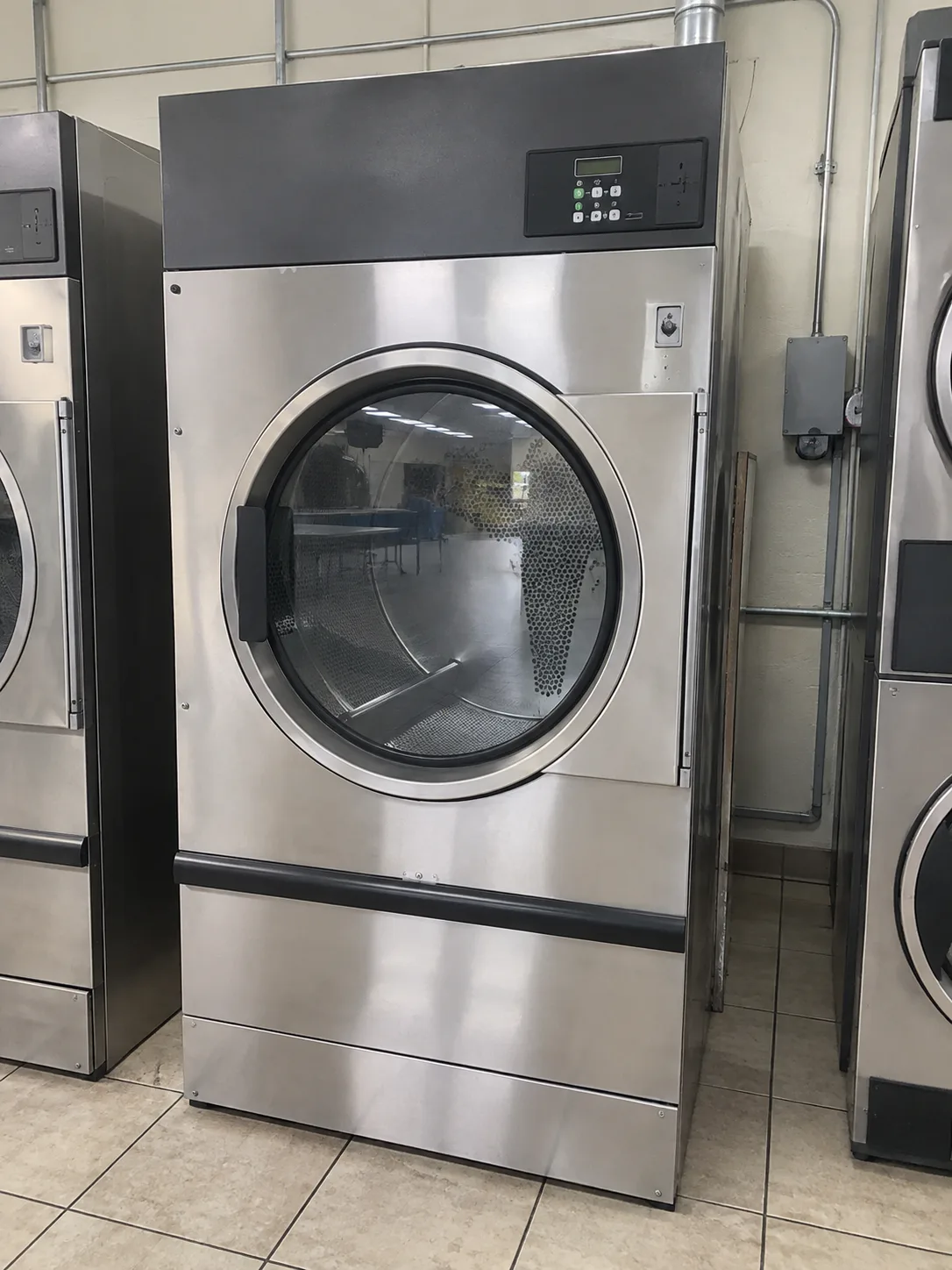 Commercial Dryer Temperature Control Corrected commercial dryer in a Tampa Bay laundry facility