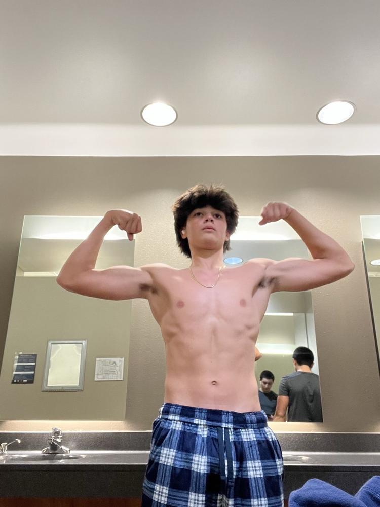 A SergLifts client showing muscle gained through online coaching