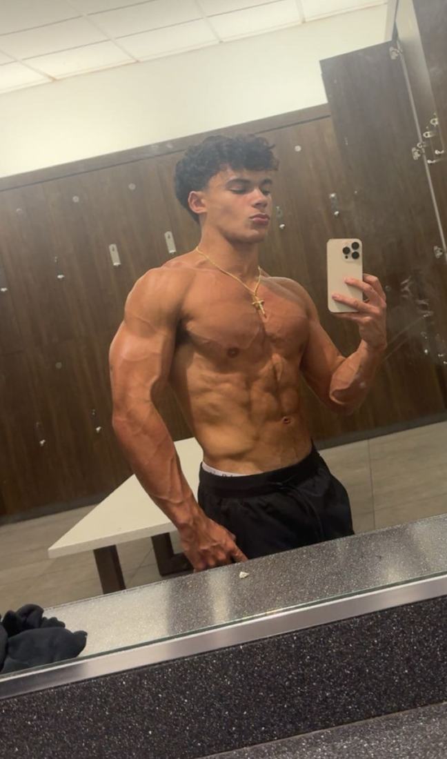 Sergio, founder of SergLifts, showing a lean, muscular natural physique