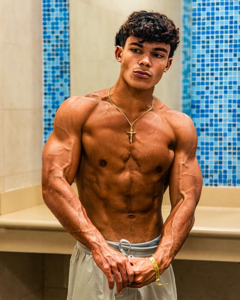 Sergio front relaxed pose showing balanced muscular development