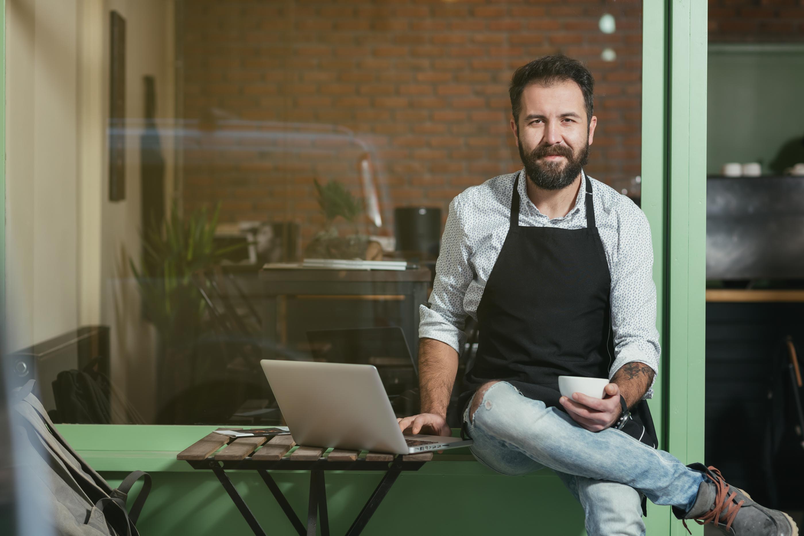 Relaxed business owner at a cafe