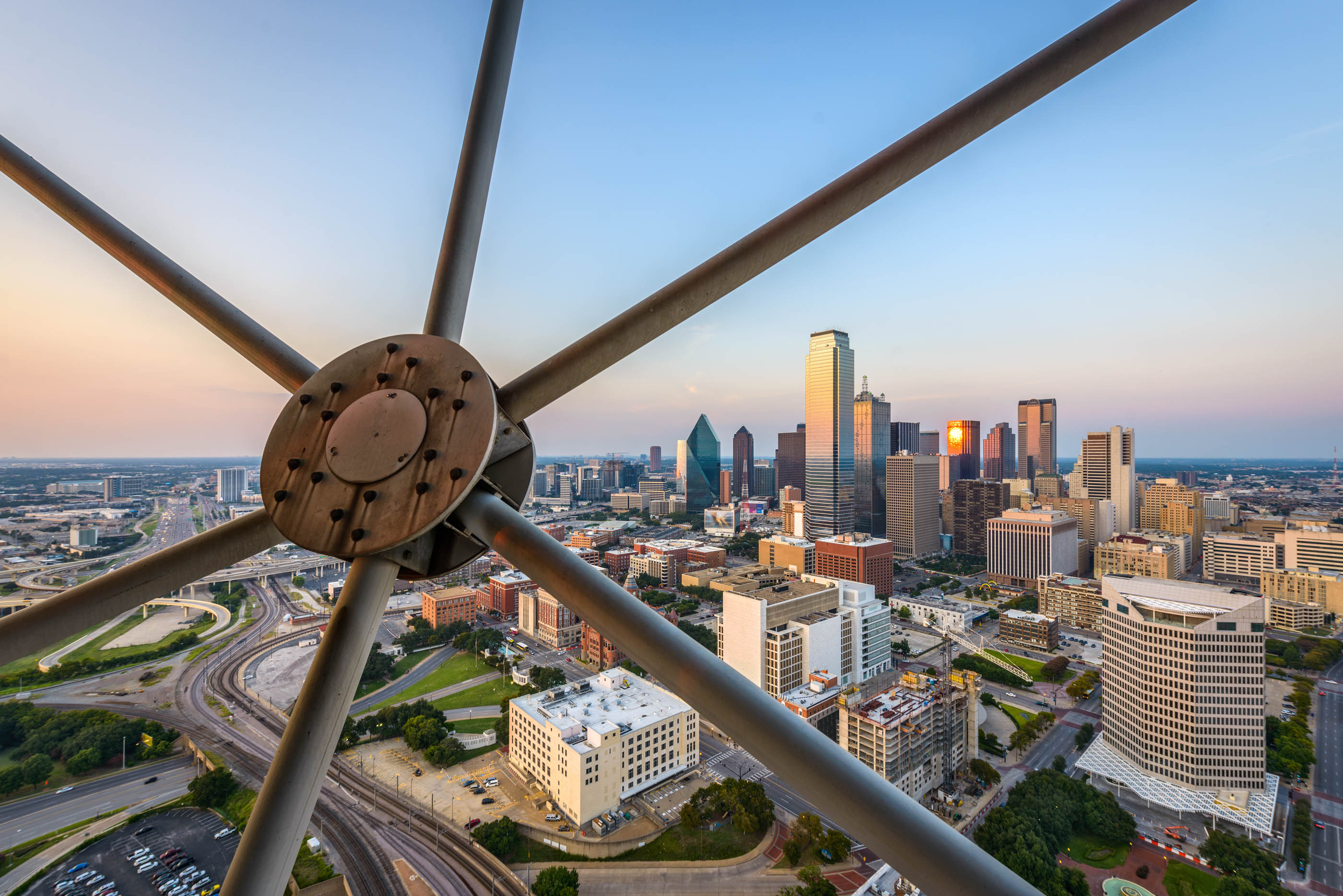 Daytime view of downtown through Reunion Tower's steel struts