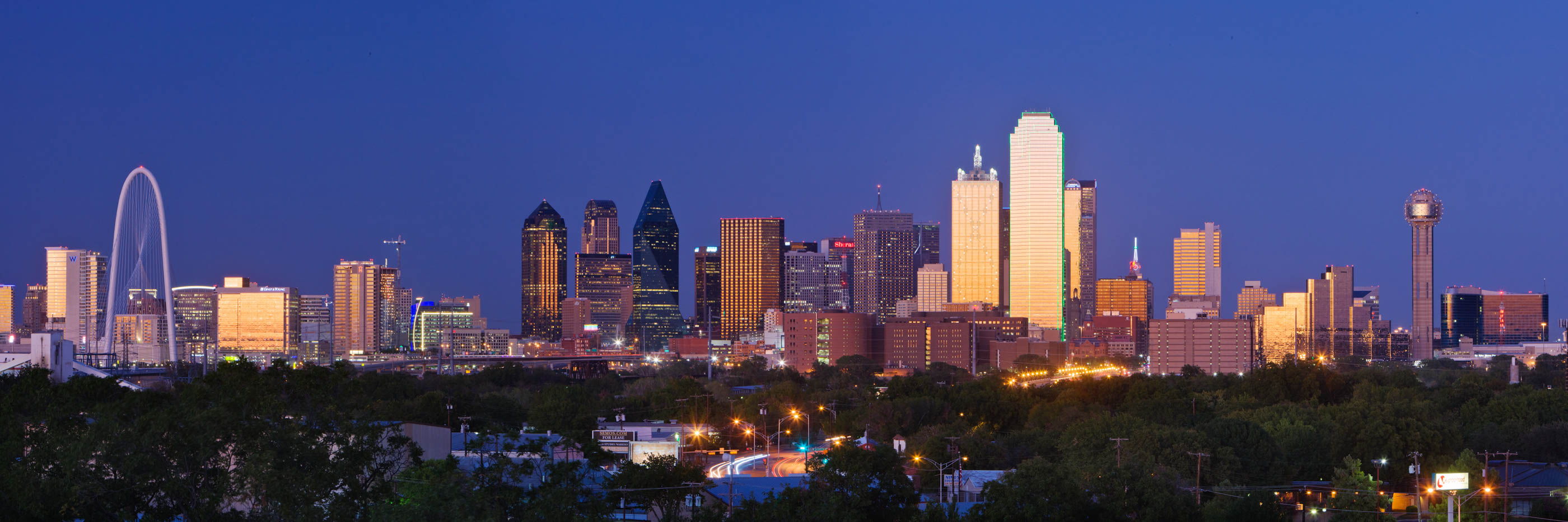 Wide panoramic strip of the skyline at dusk
