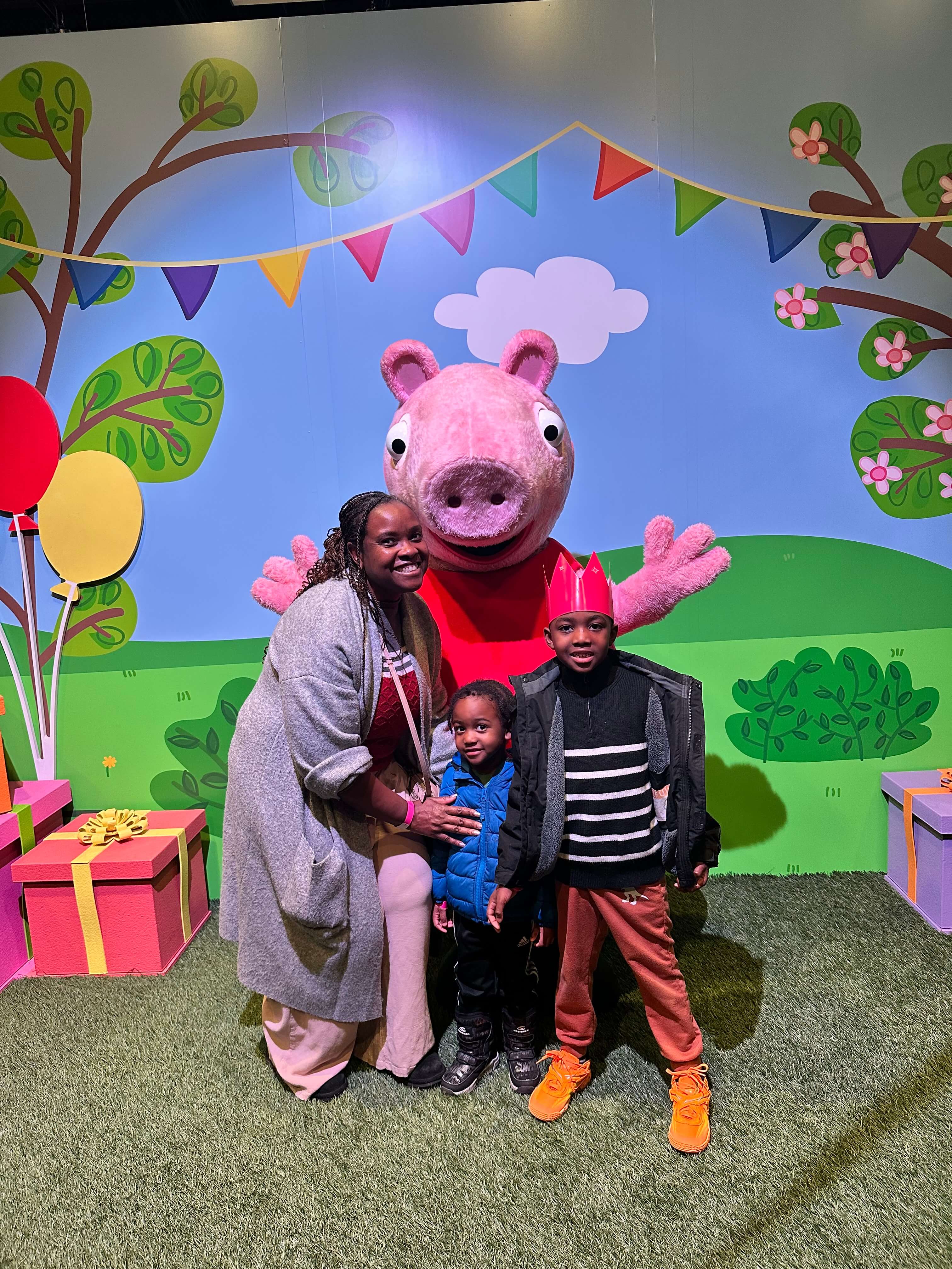 mom and sons taking picture with peppa pig at camp experience mom and sons taking picture with peppa pig at camp experience