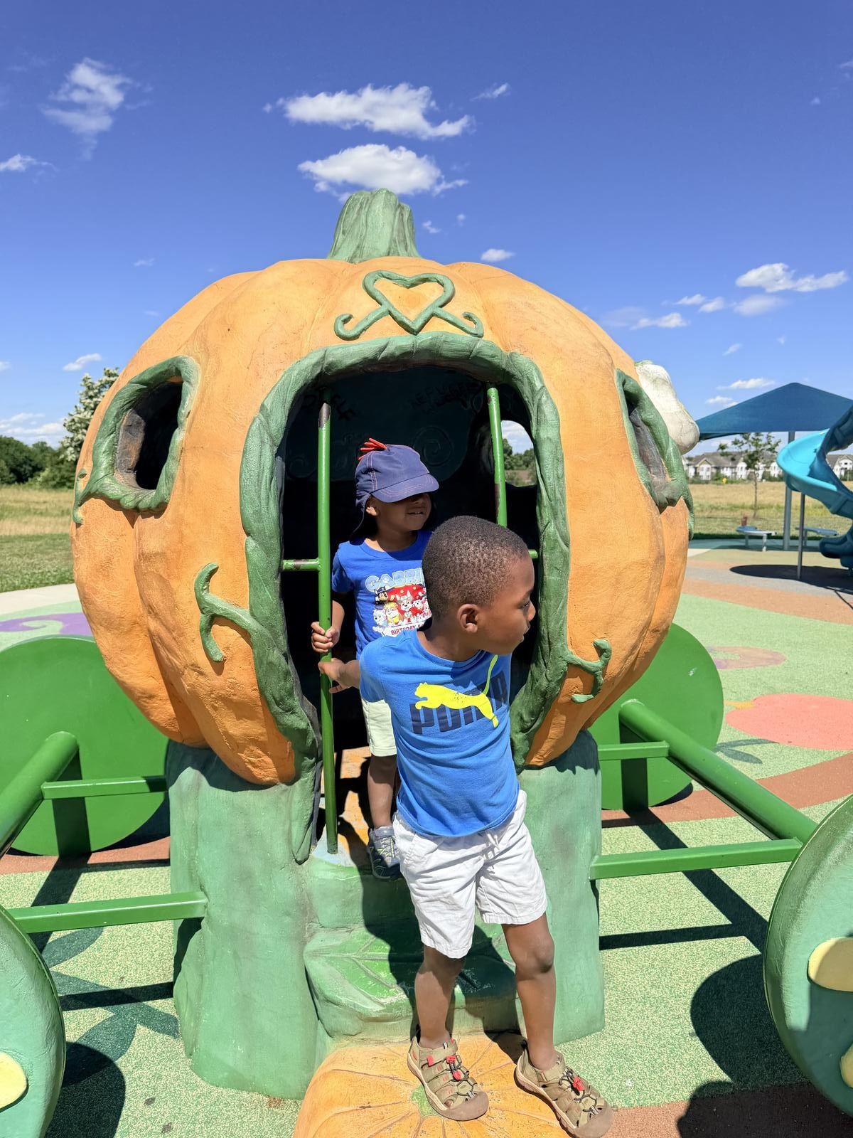 Two children climbing in the Cinderella pumpkin carriage at Sophie and Madigan's Playground, a fairytale themed park in Frederick, Maryland Two children climbing in the Cinderella pumpkin carriage at Sophie and Madigan's Playground, a fairytale themed park in Frederick, Maryland