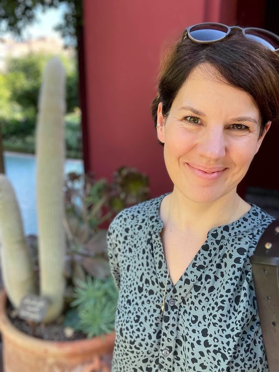 Portrait of the founder in an editorial style, three-quarter view, soft studio light, neutral background