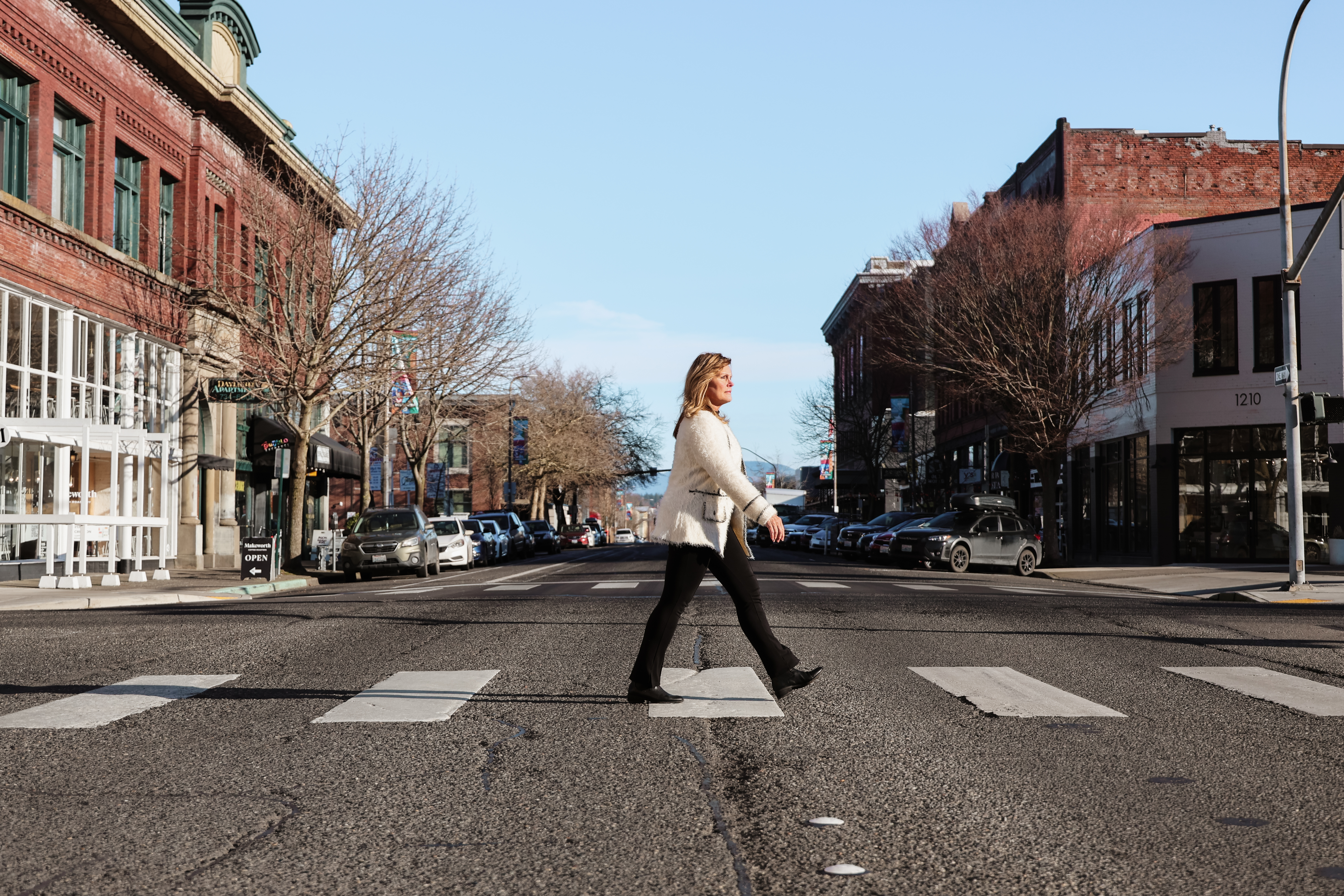 Barbara walking in a city crosswalk