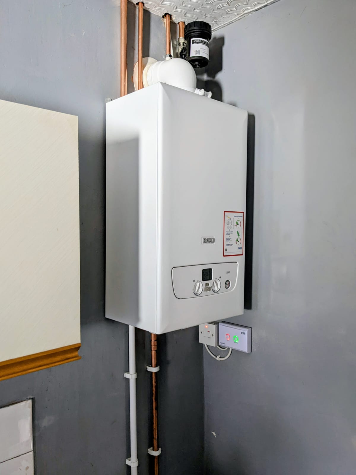 Completed wall-mounted boiler installation