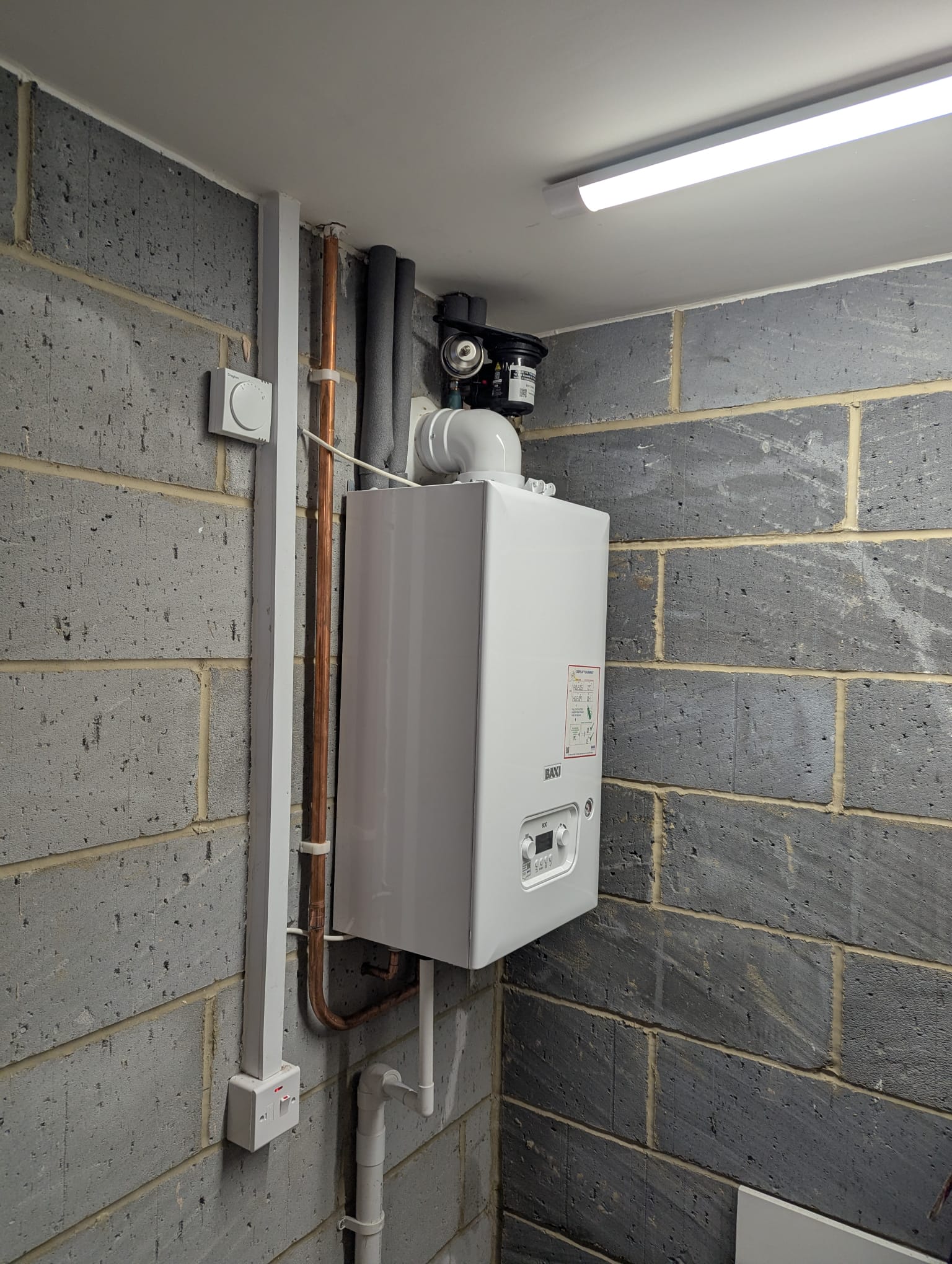 Boiler installed in utility area with system filter