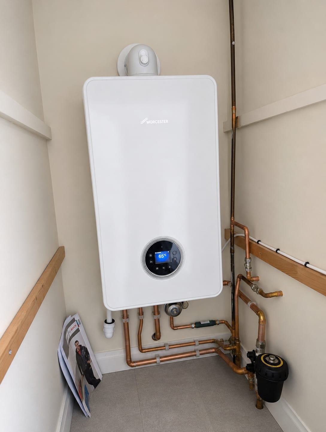 Wall-mounted boiler with detailed copper pipework