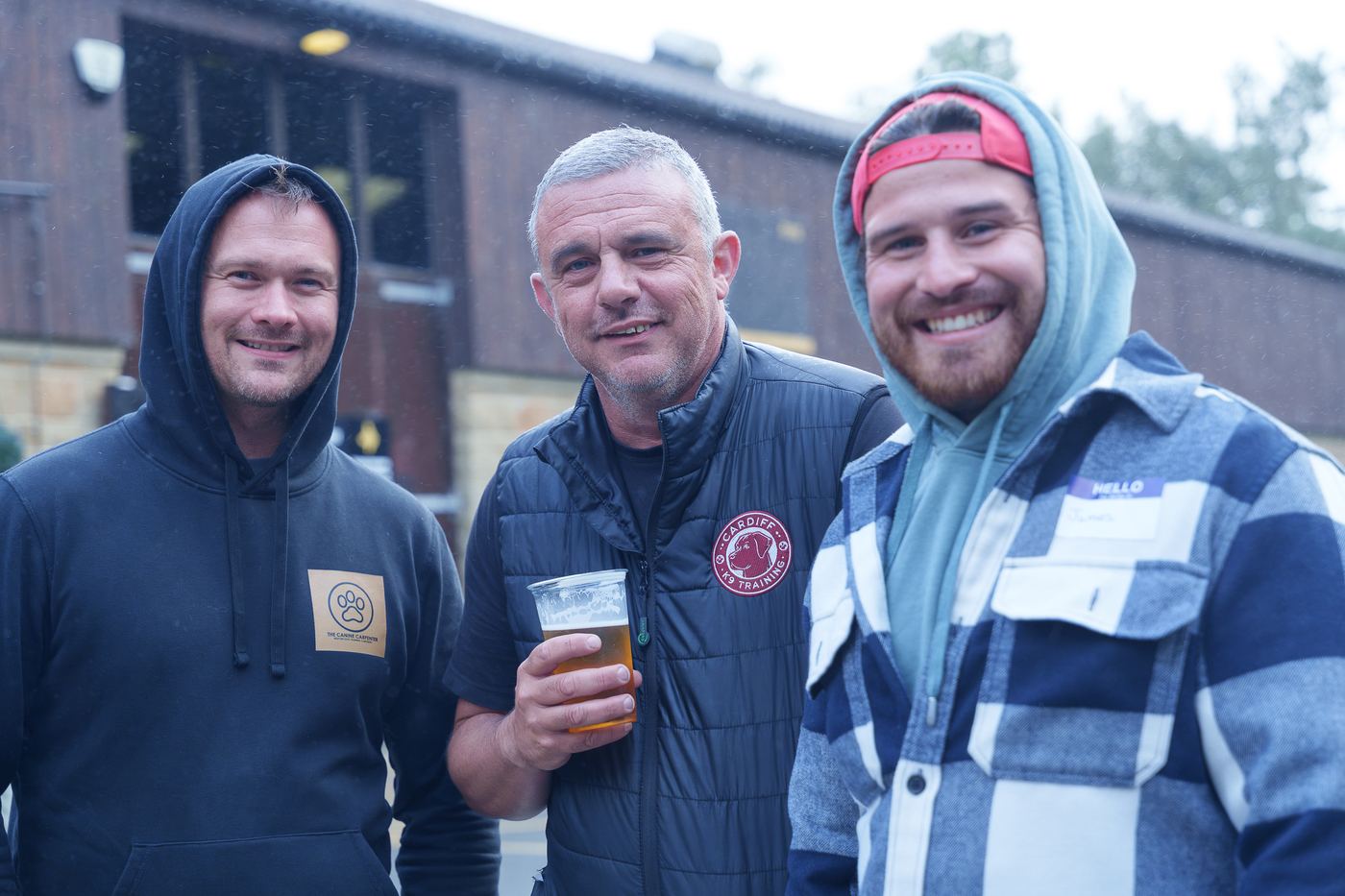 Three members outside the training centre