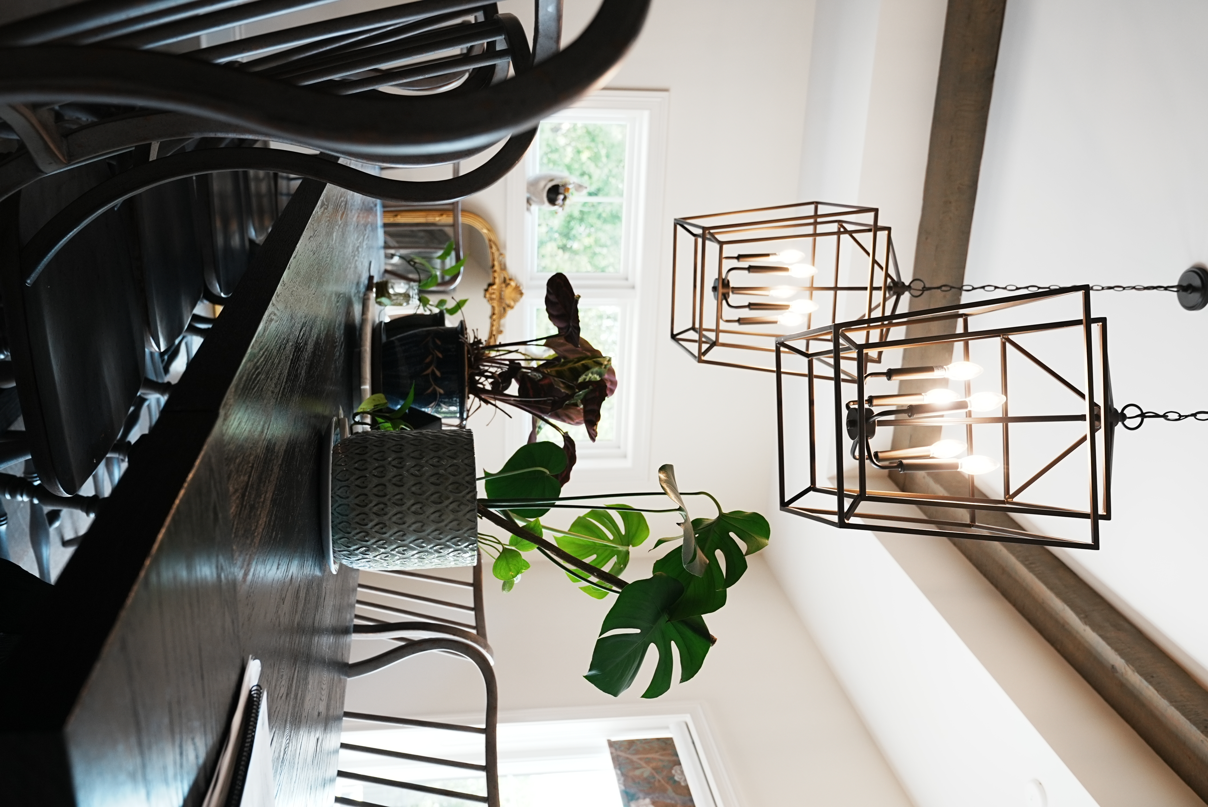 Dining area with lantern-style pendant lights