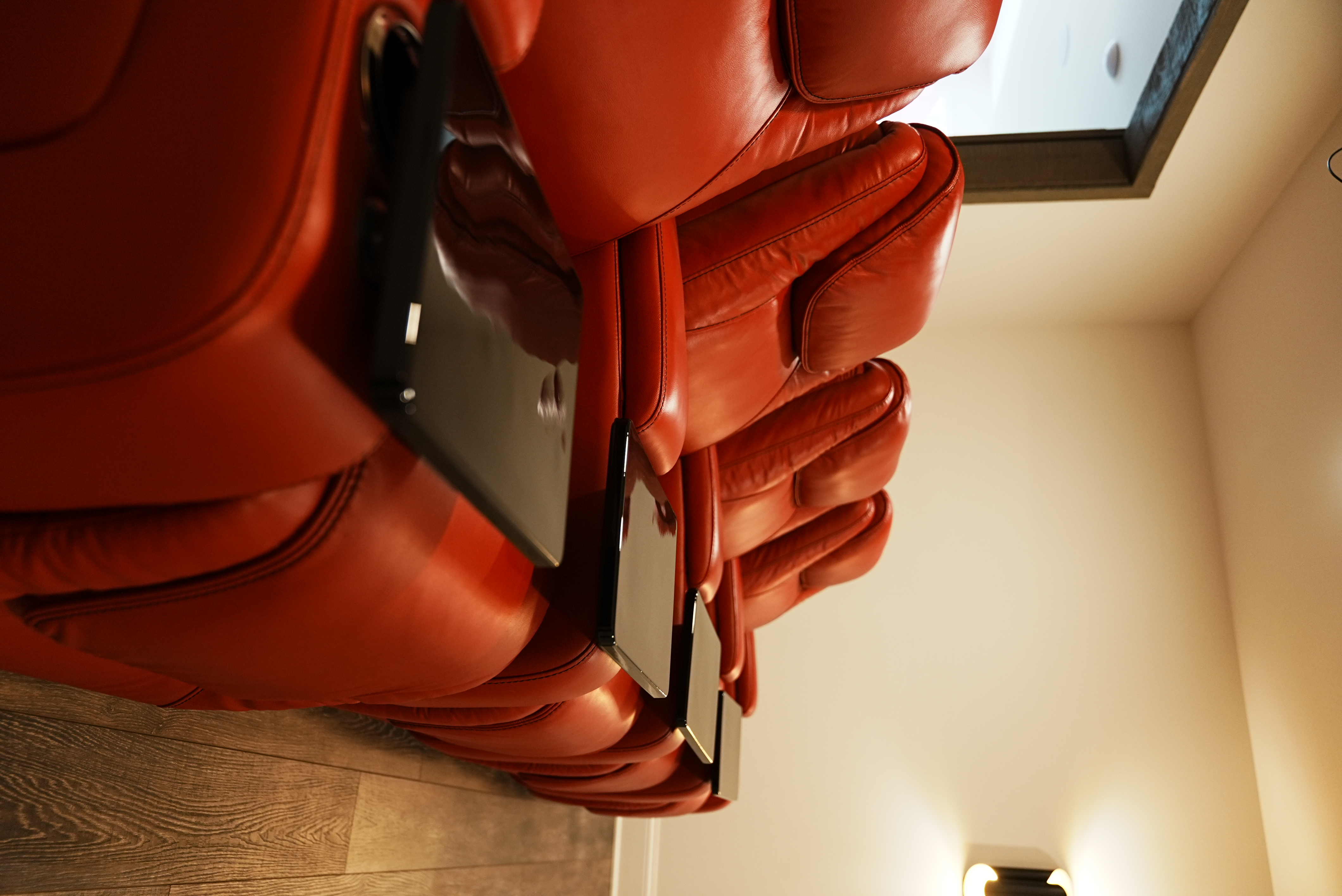 Home theater with red leather reclining seats