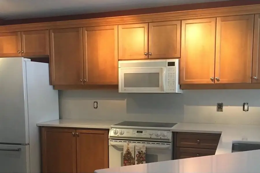 Cabinets before painting by Turtle Painting