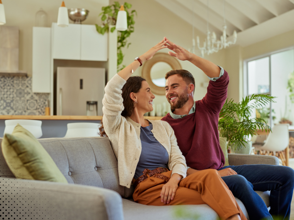 Homebuyers celebrating inside a newer North Texas home after completing a professional home inspection