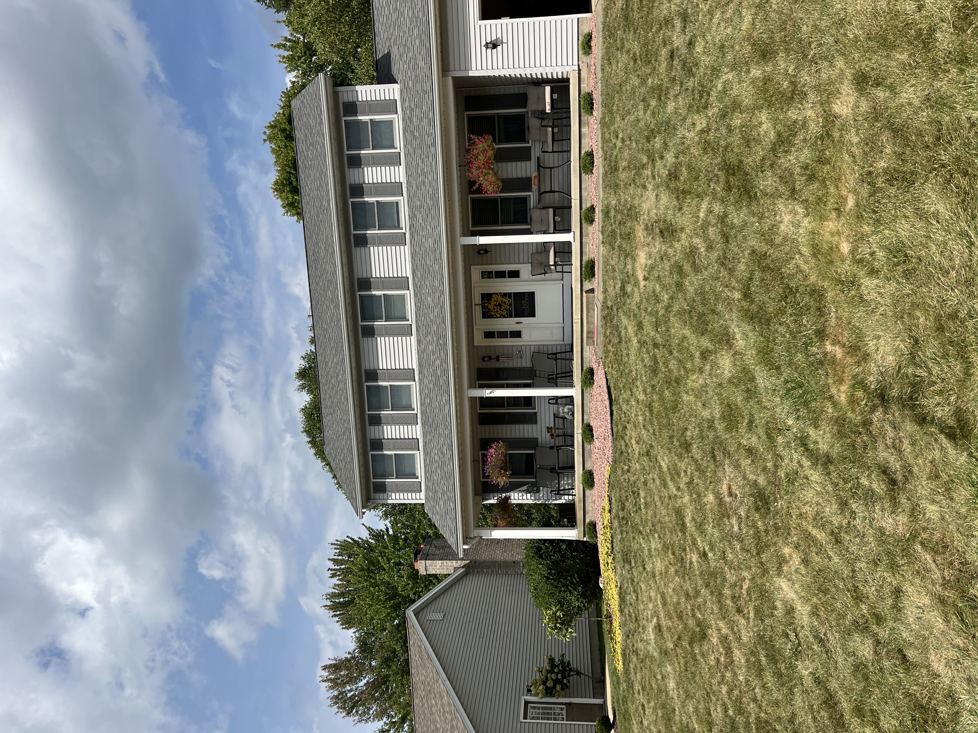 A house with fresh landscaping after an installation.