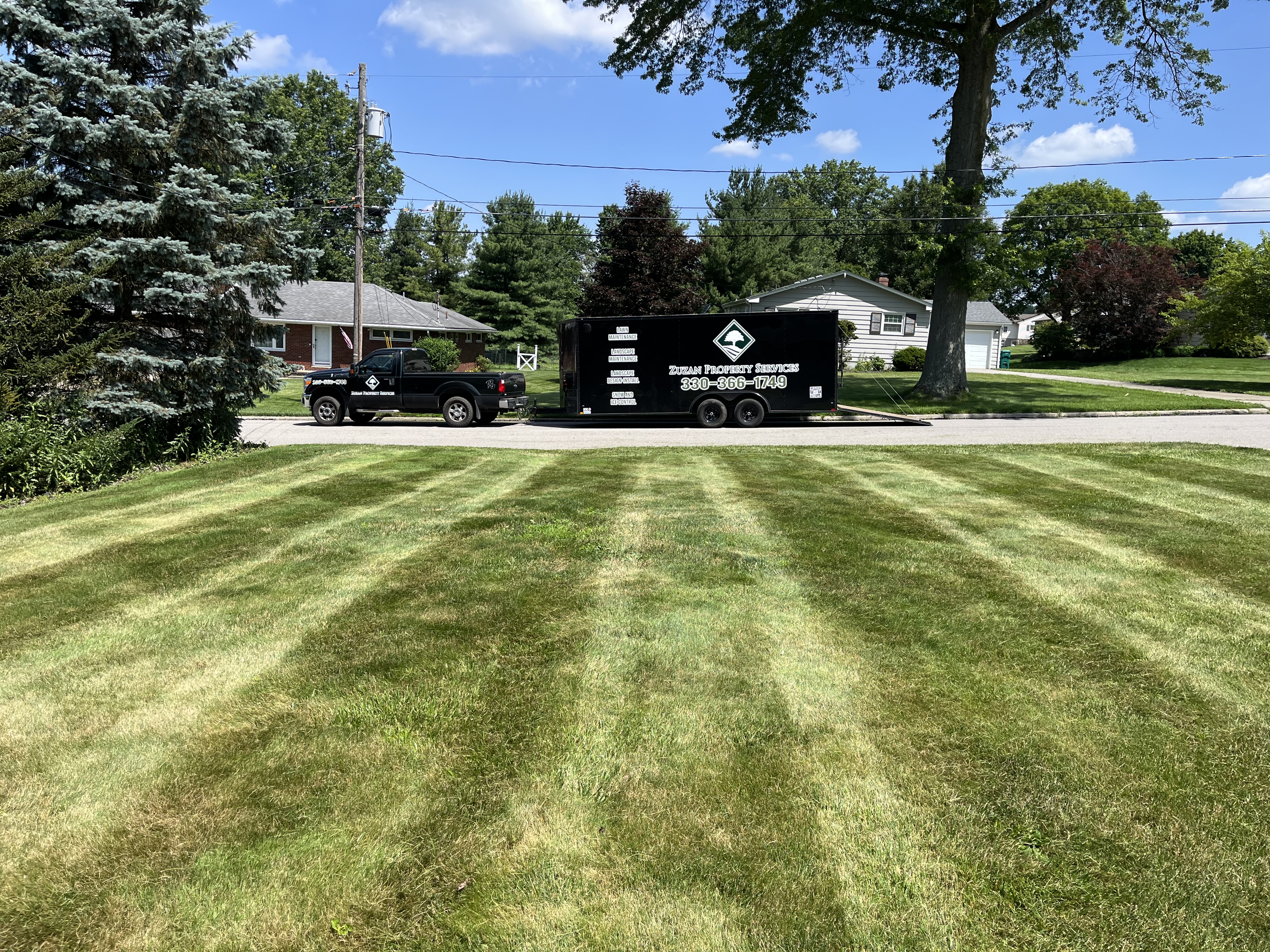 A green lawn maintained by Zuzan Property Services
