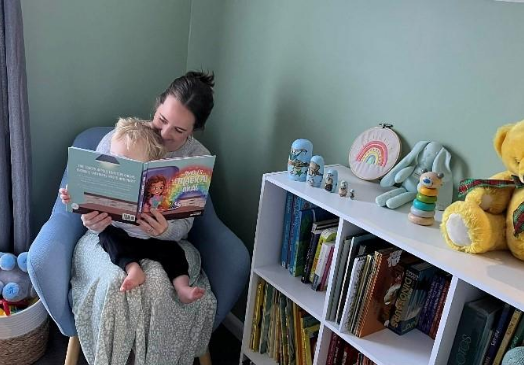 Krystal Wade reading with her son