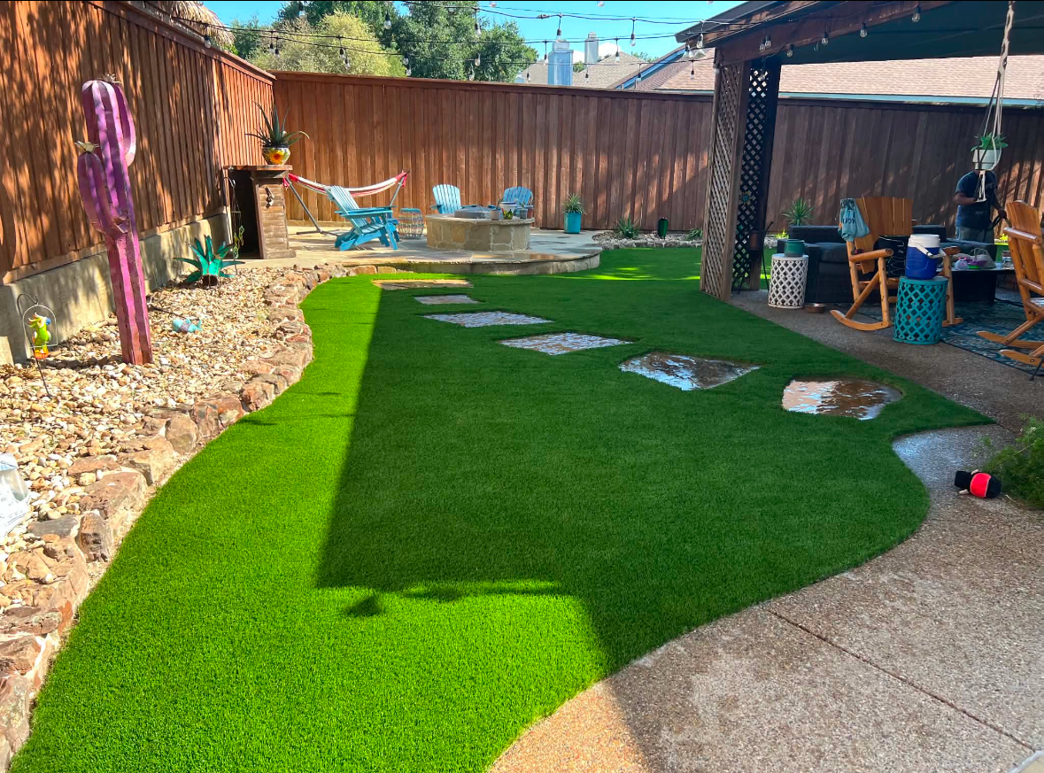 Matted artificial turf beside a freshly brushed section of the same lawn in Fort Worth, Texas