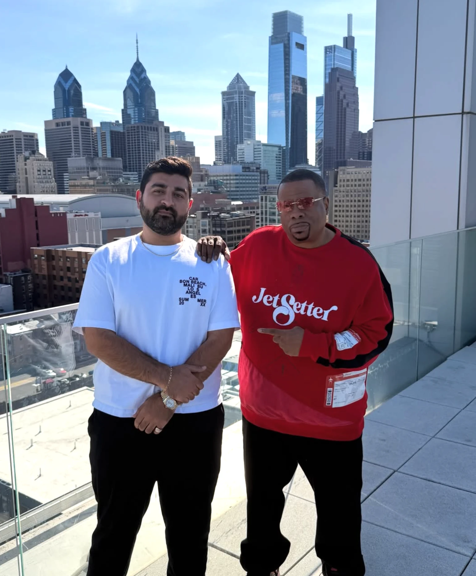 Peter Tayoun Sharma with DJ Cosmic Kev on a Center City rooftop